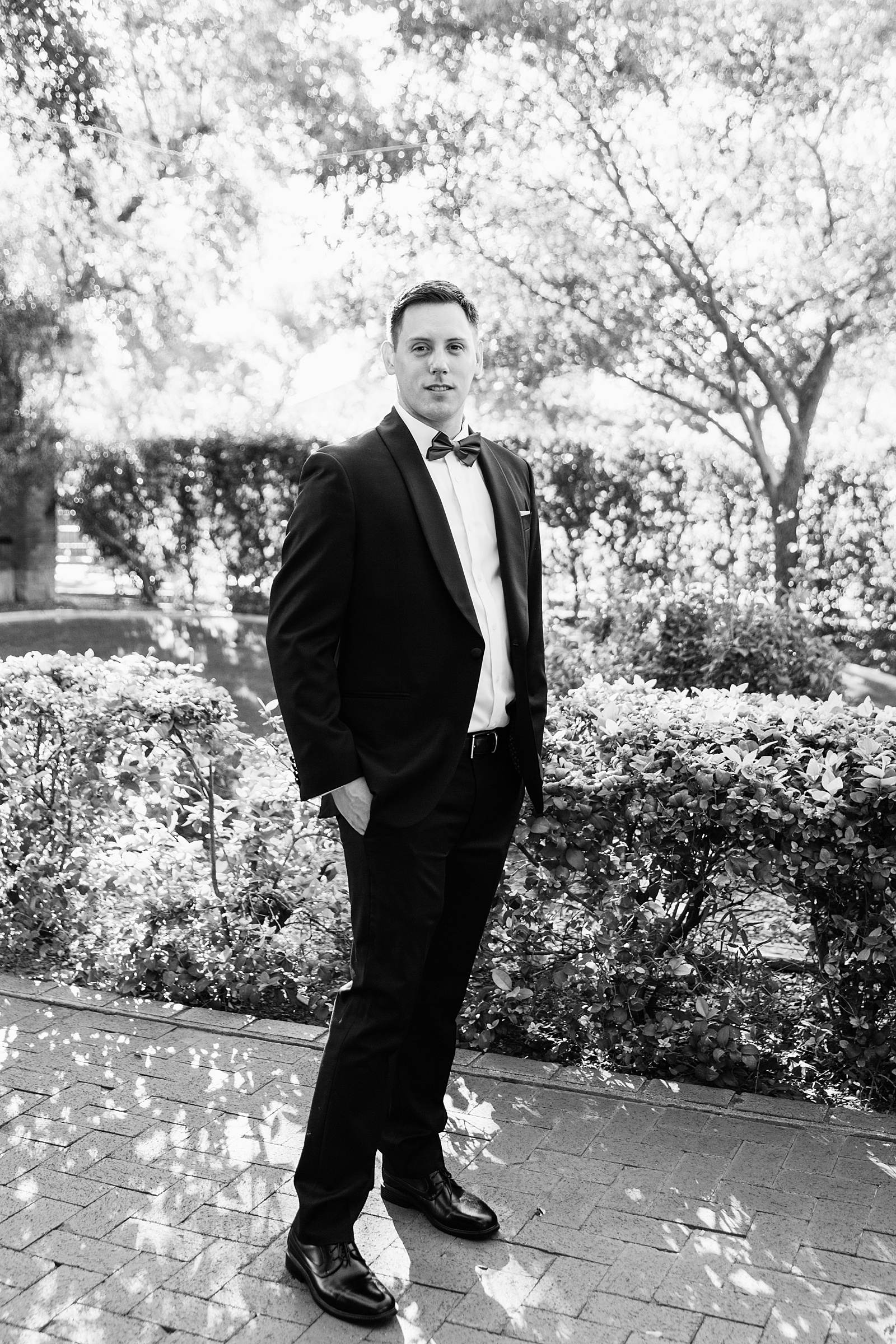 Black and white portrait of the groom by Mesa wedding photographer PMA Photography.