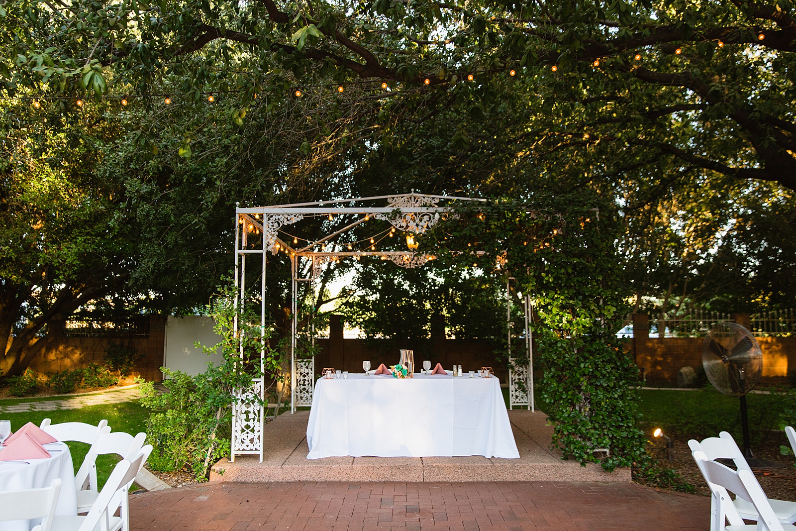 Sweetheart table at a garden reception at Stonebridge Manor by PMA Photography.