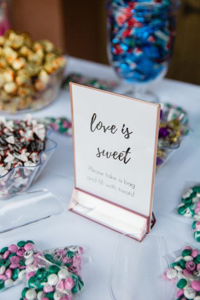 Love is Sweet candy table for wedding favors by Arizona wedding photographer PMA Photography.