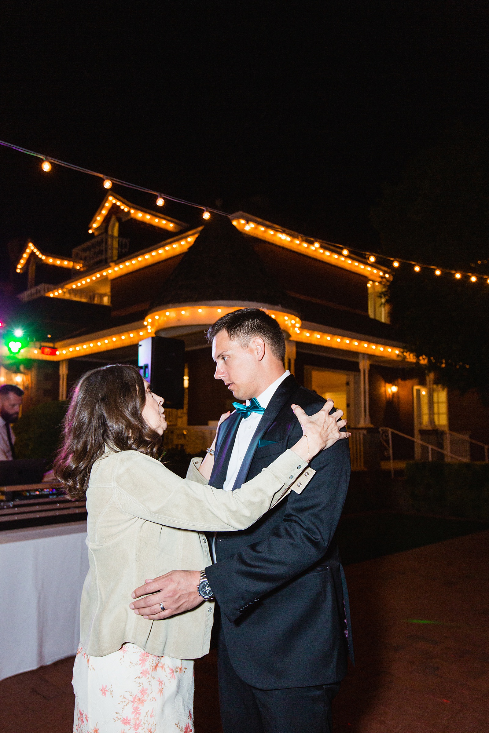 Groom dancing with guests at Stonebridge Manor wedding reception by Mesa wedding photographer PMA Photography
