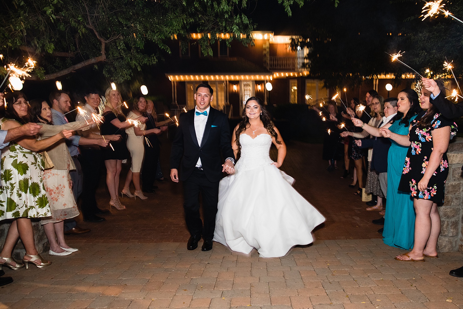 Bride and Groom's sparkler exit at Stonebridge Manor wedding reception by Arizona wedding photographer PMA Photography.