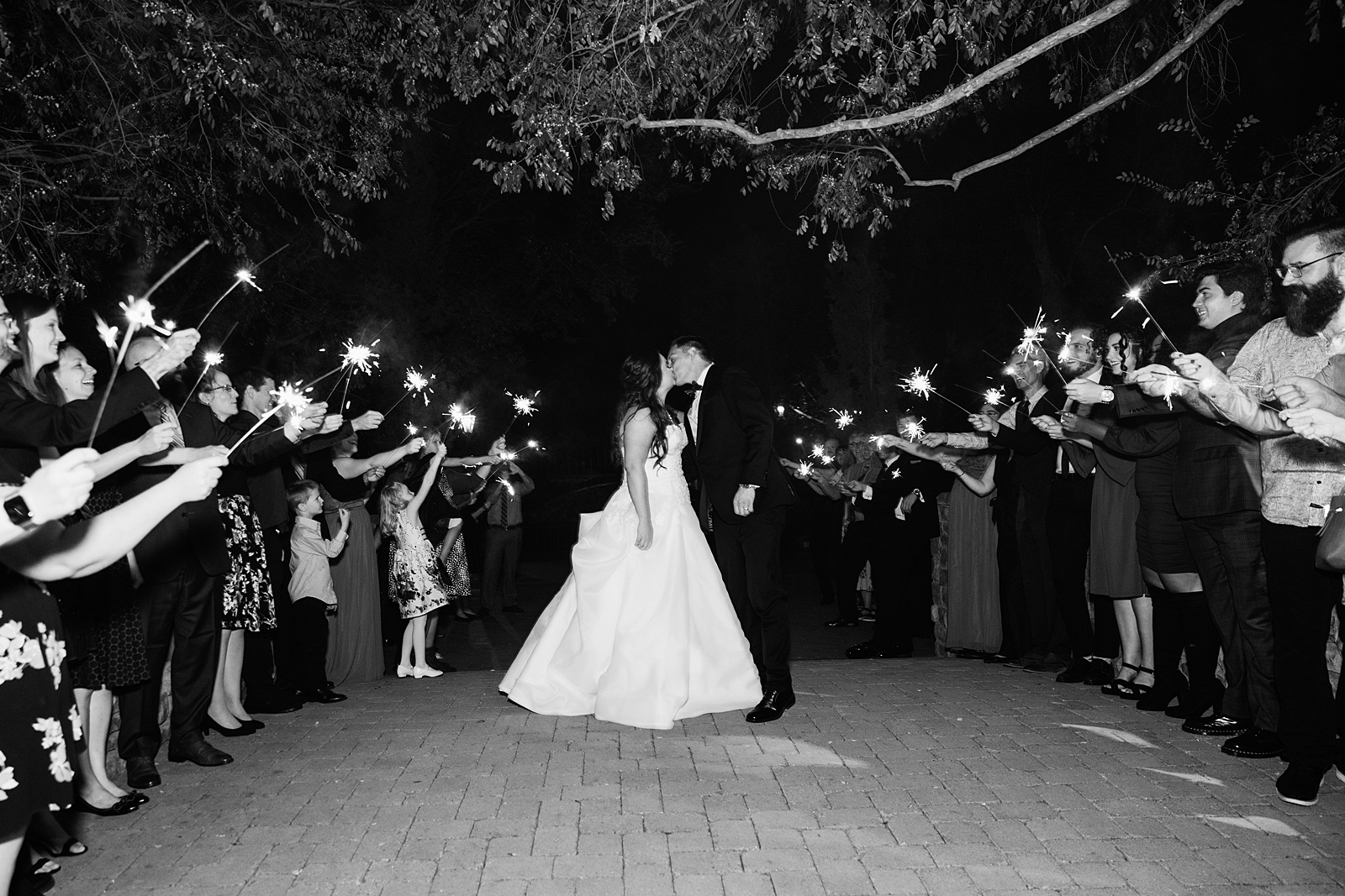 Bride and Groom's sparkler exit at Stonebridge Manor wedding reception by Arizona wedding photographer PMA Photography.