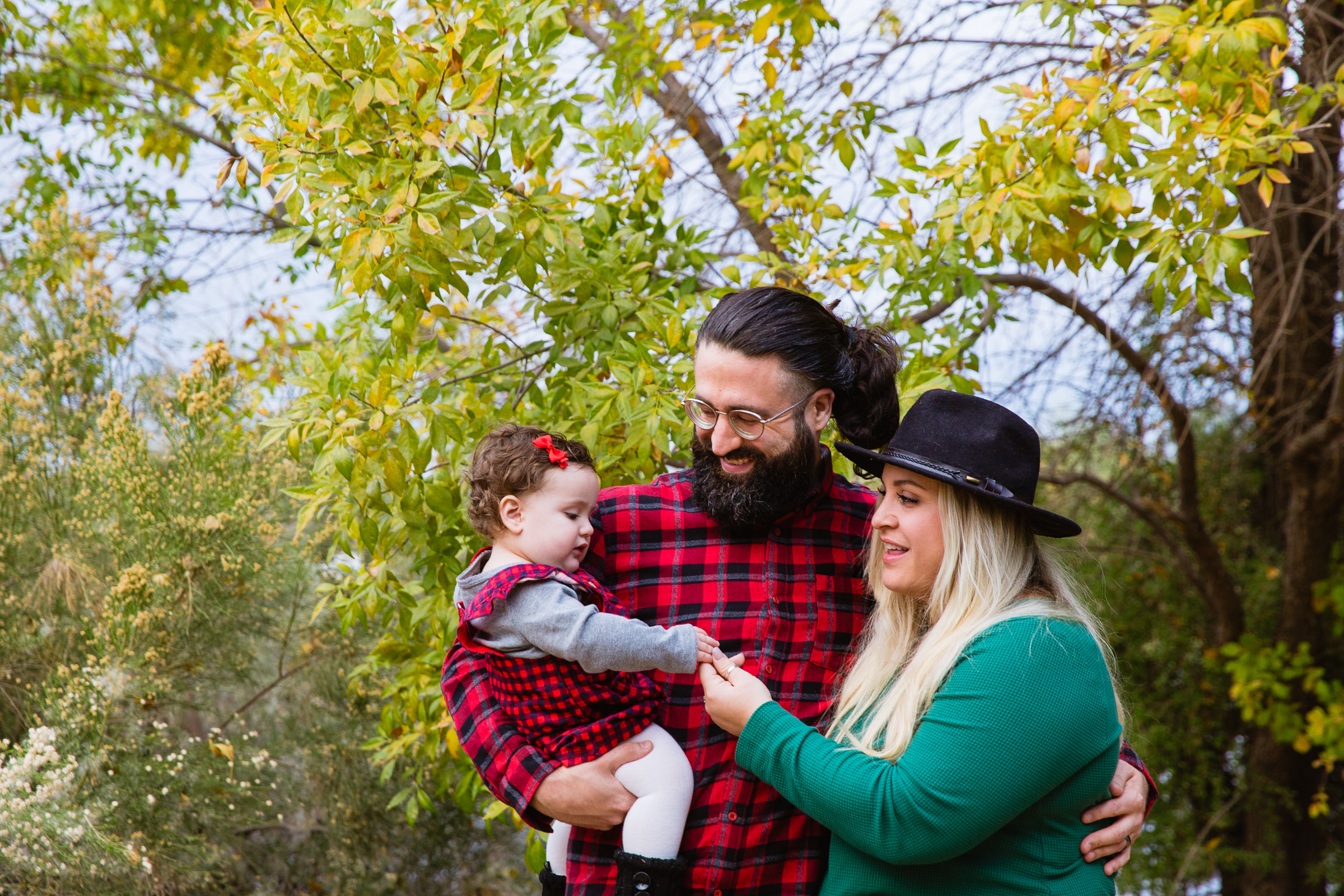 Family having fun together at their Gilbert family session by Arizona family photographer PMA Photography.