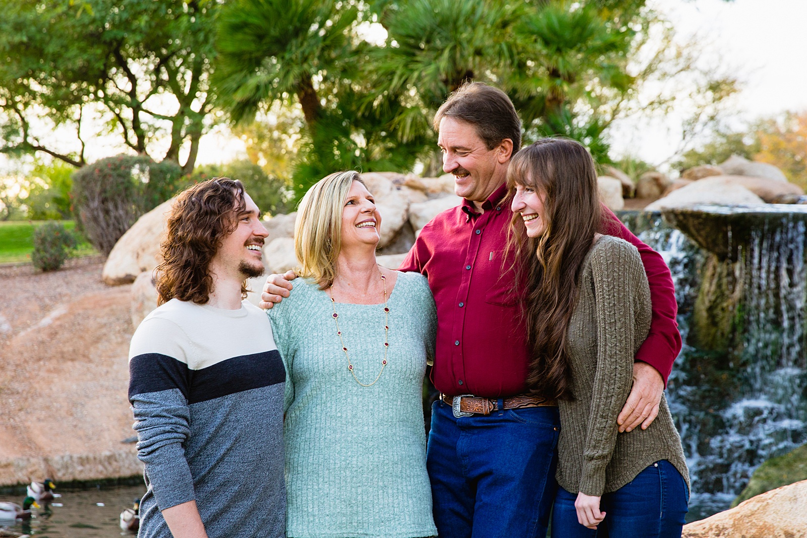 Family laughing together during their Anthem family session by Arizona family photographer PMA Photography.