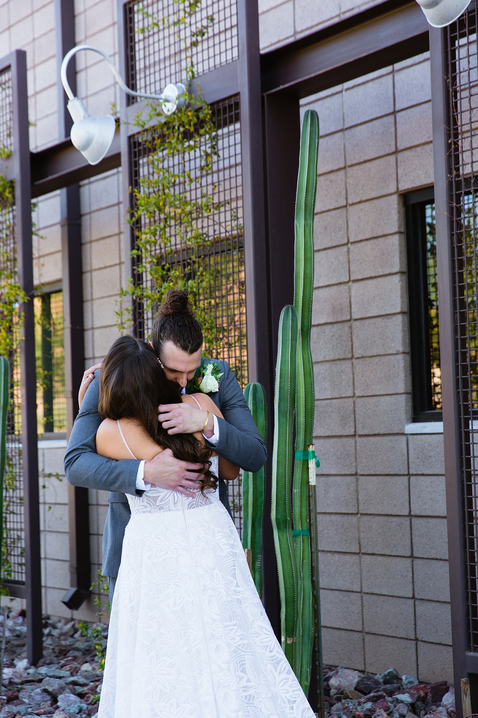 Bride and groom's first look at Papago Events by Phoenix wedding photographer PMA Photography.