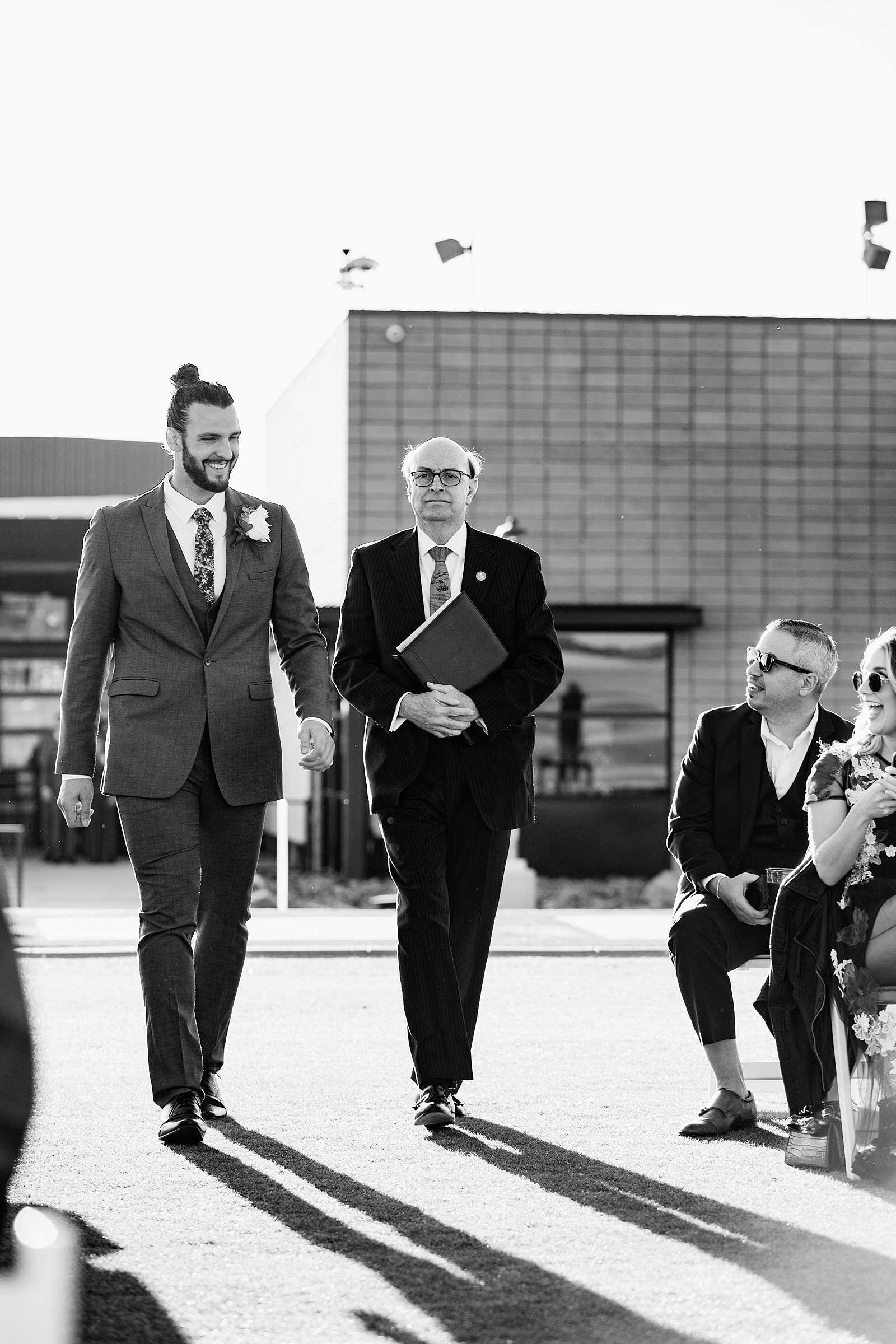 Groom walking down aisle during Papago Events wedding ceremony by Phoenix wedding photographer PMA Photography.