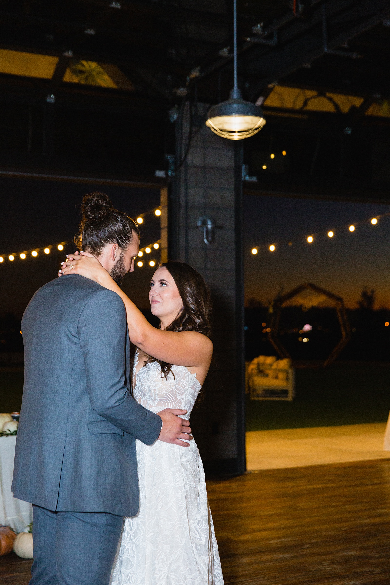 Bride and groom sharing first dance at their Papago Events wedding reception by Arizona wedding photographer PMA Photography.