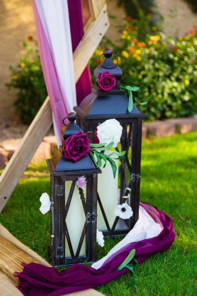 Lantern decorations around a ceremony altar by Arizona wedding photographer PMA Photography.