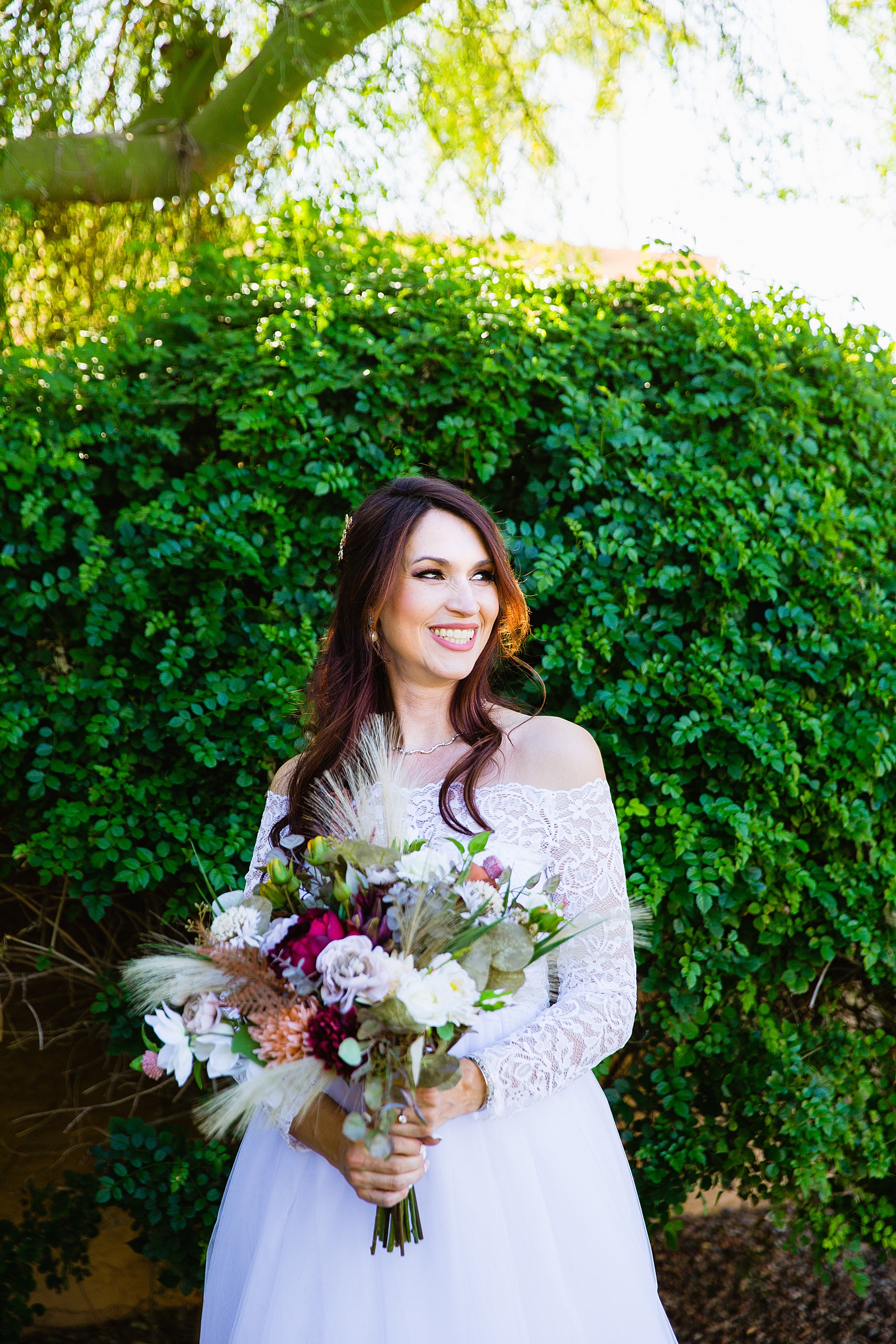 Bride's simple white lace wedding dress for her Backyard Micro wedding by PMA Photography.