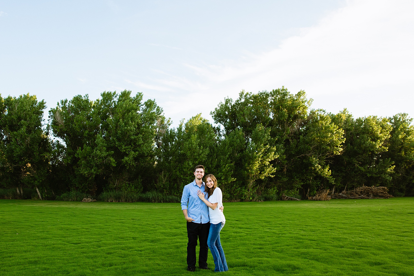 Couple pose for their Gilbert engagement session by Gilbert wedding photographer PMA Photography.