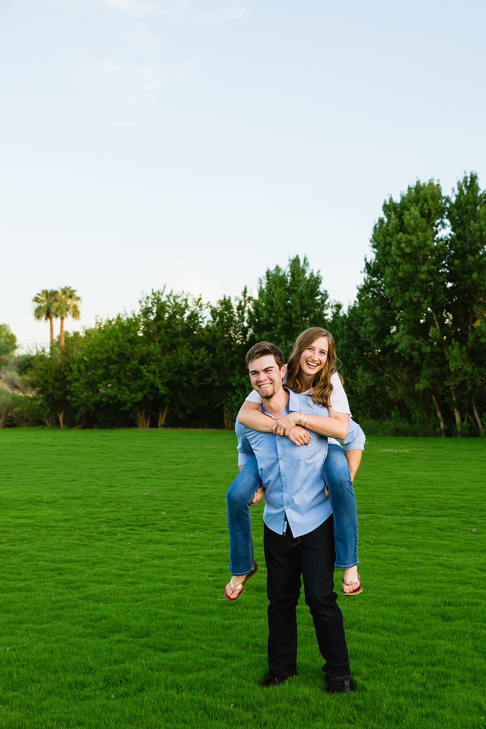 Couple laugh together during their Gilbert engagement session by Gilbert engagement photographer PMA Photography.