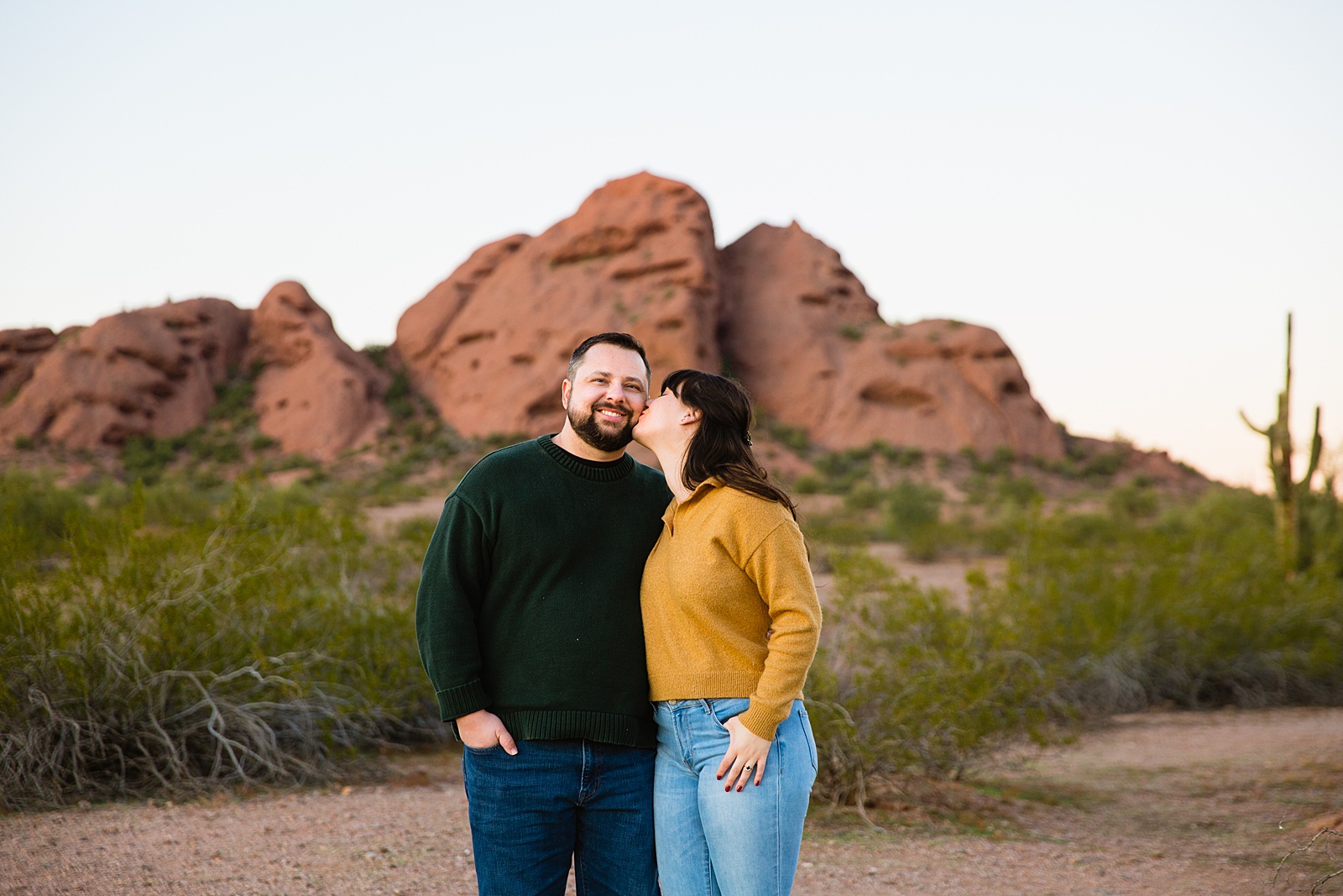 Couple having fun together during their Papago Park engagement session by Phoenix engagement photographer PMA Photography.