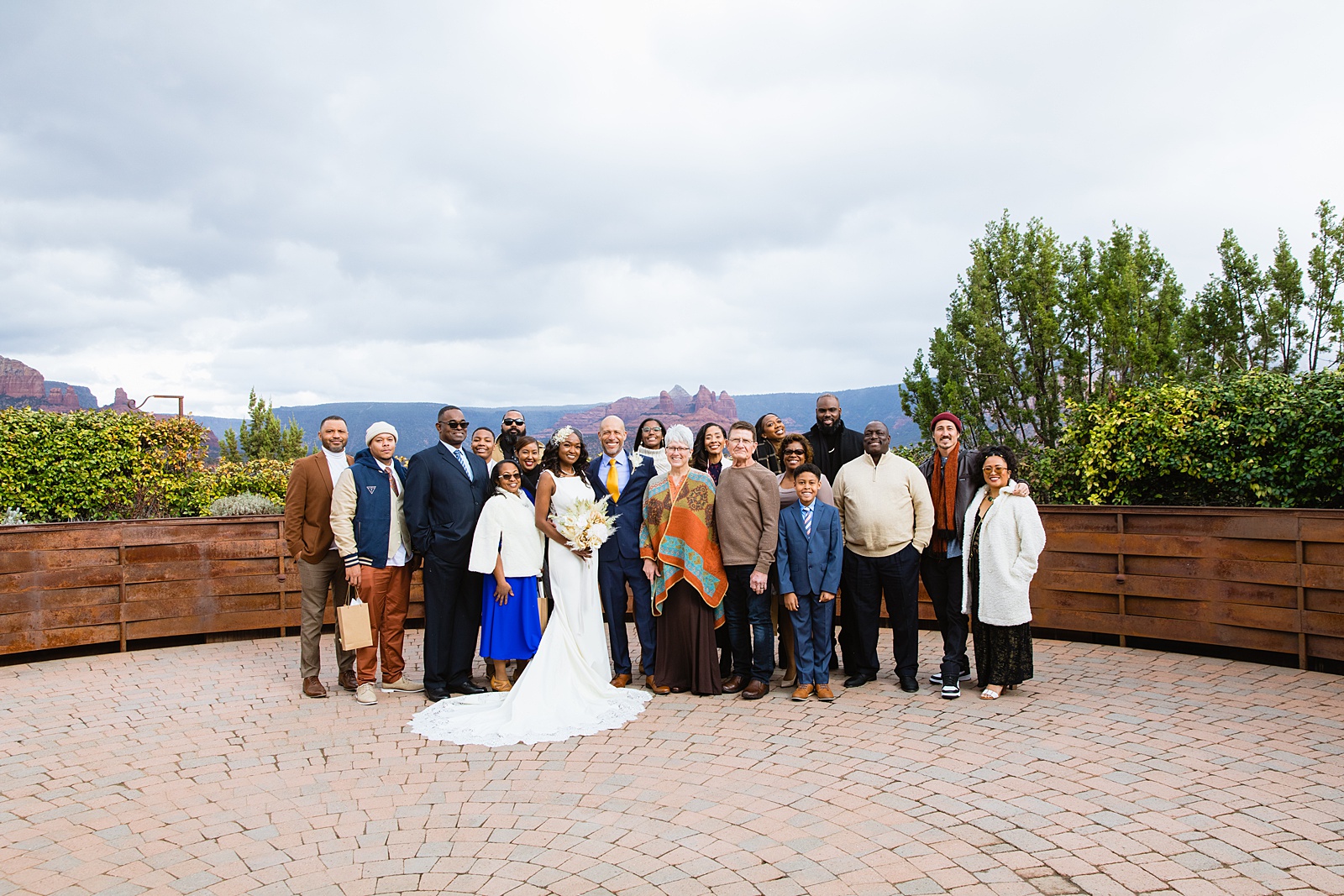 Newlywed couple with their family and guests at their Agave of Sedona micro wedding by Arizona wedding photographer PMA Photography.