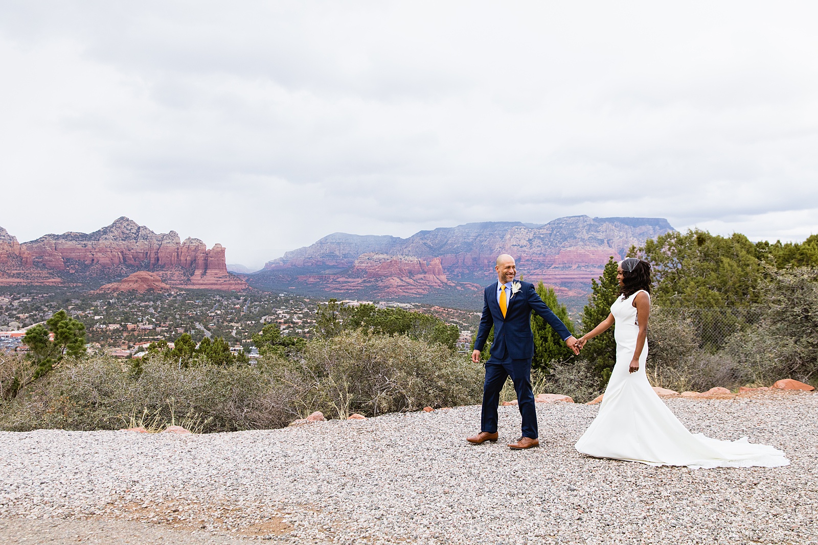 Bride and Groom walking together during their Agave of Sedona wedding by Sedona wedding photographer PMA Photography.