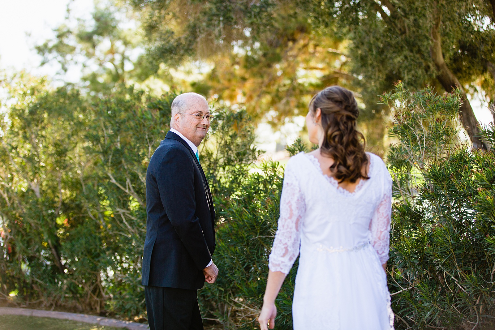 Bride's first look with her father at Ocotillo Oasis by Phoenix wedding photographer PMA Photography.