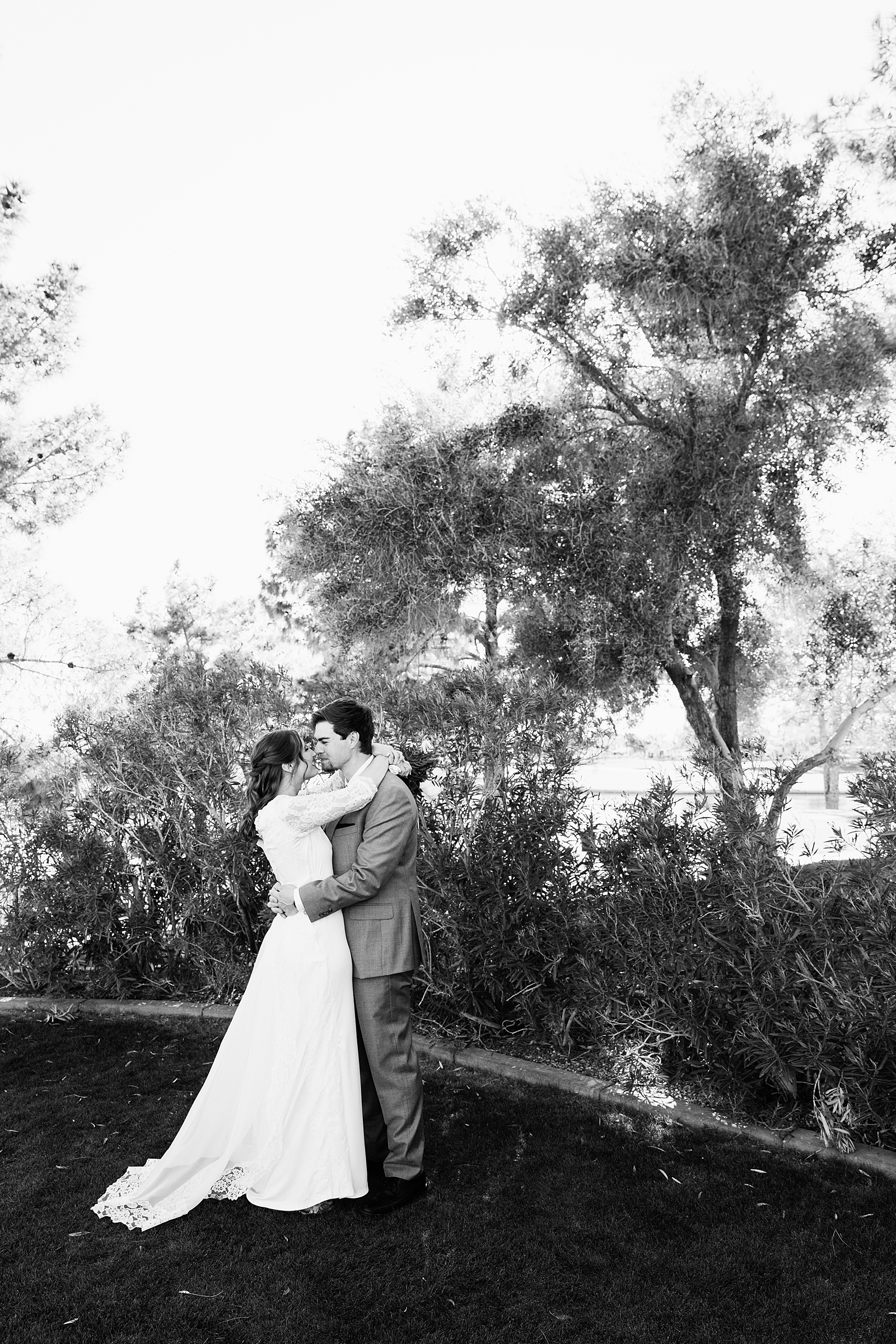 Bride and groom share an intimate moment at their Ocotillo Oasis wedding by Arizona wedding photographer PMA Photography.