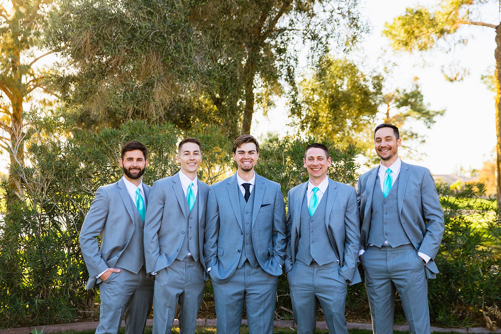 Groom and groomsmen together at a Ocotillo Oasis wedding by Arizona wedding photographer PMA Photography.