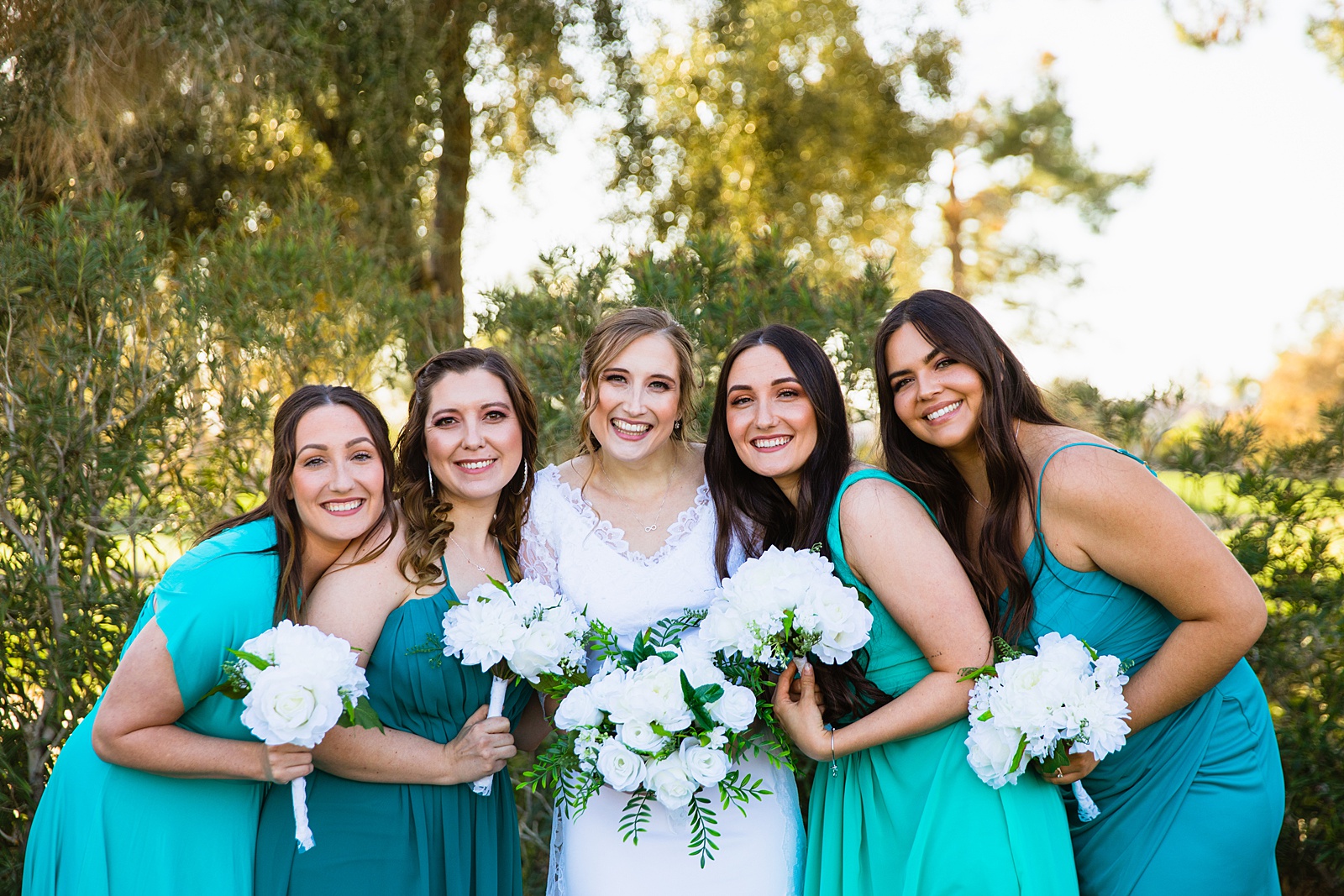 Bride and bridesmaids together at a Ocotillo Oasis wedding by Arizona wedding photographer PMA Photography.