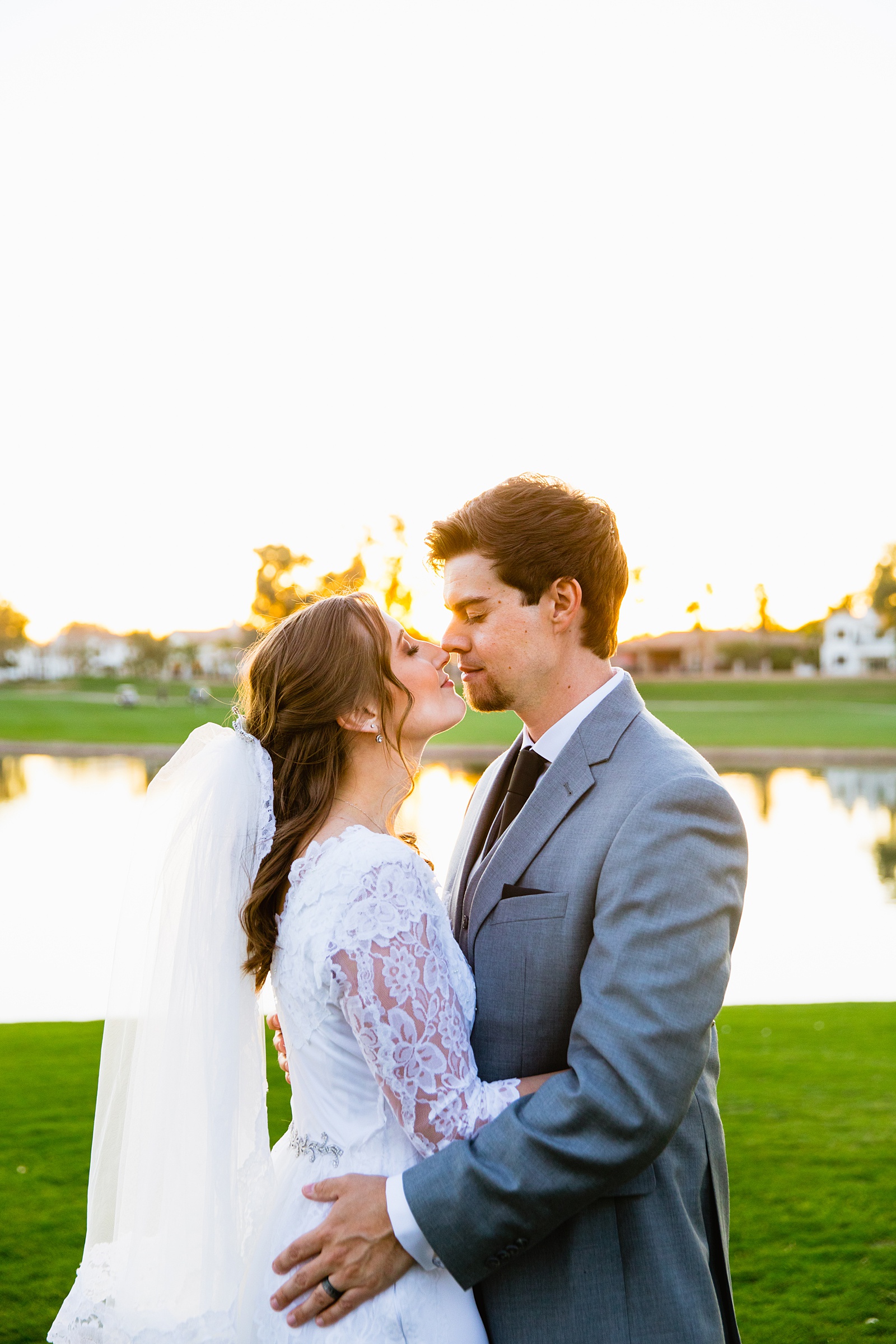 Newlyweds share an intimate moment during their Ocotillo Oasis wedding by Phoenix wedding photographer PMA Photography.