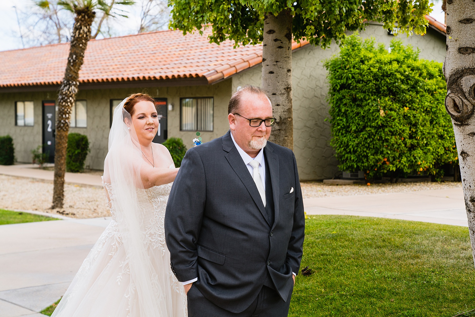 Newlyweds's first look at Sun Valley Church by Phoenix wedding photographer PMA Photography.