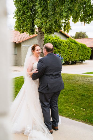 Newlyweds's first look at Sun Valley Church by Phoenix wedding photographer PMA Photography.