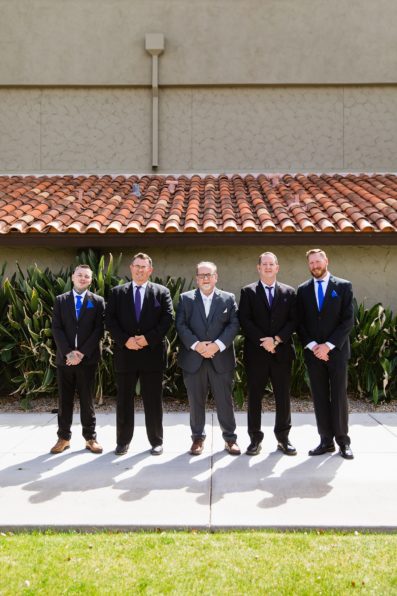 Groom and groomsmen together at a Sun Valley Church wedding by Arizona wedding photographer PMA Photography.