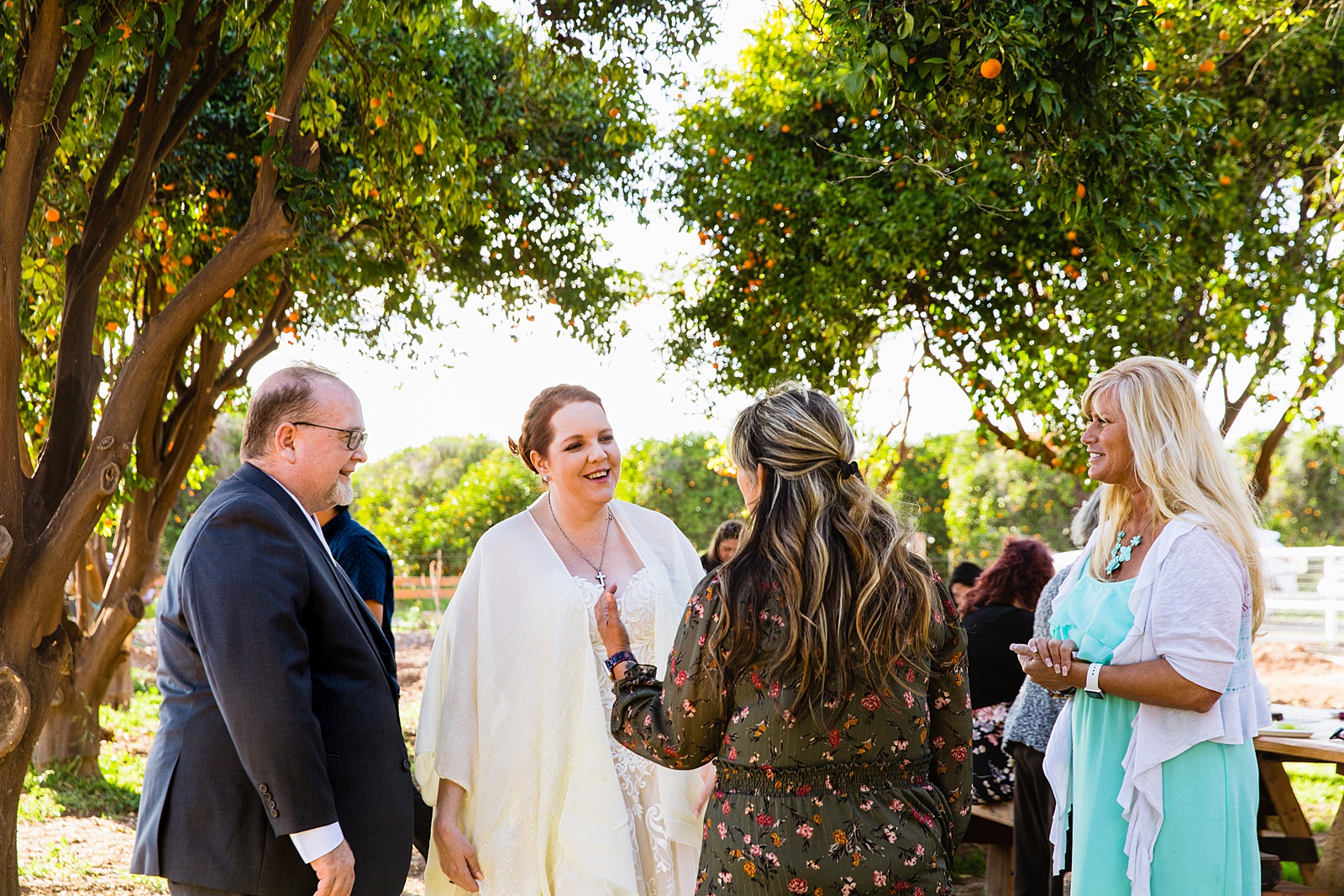 Groom with guests at 101 Polo Club wedding reception by Tempe wedding photographer PMA Photography