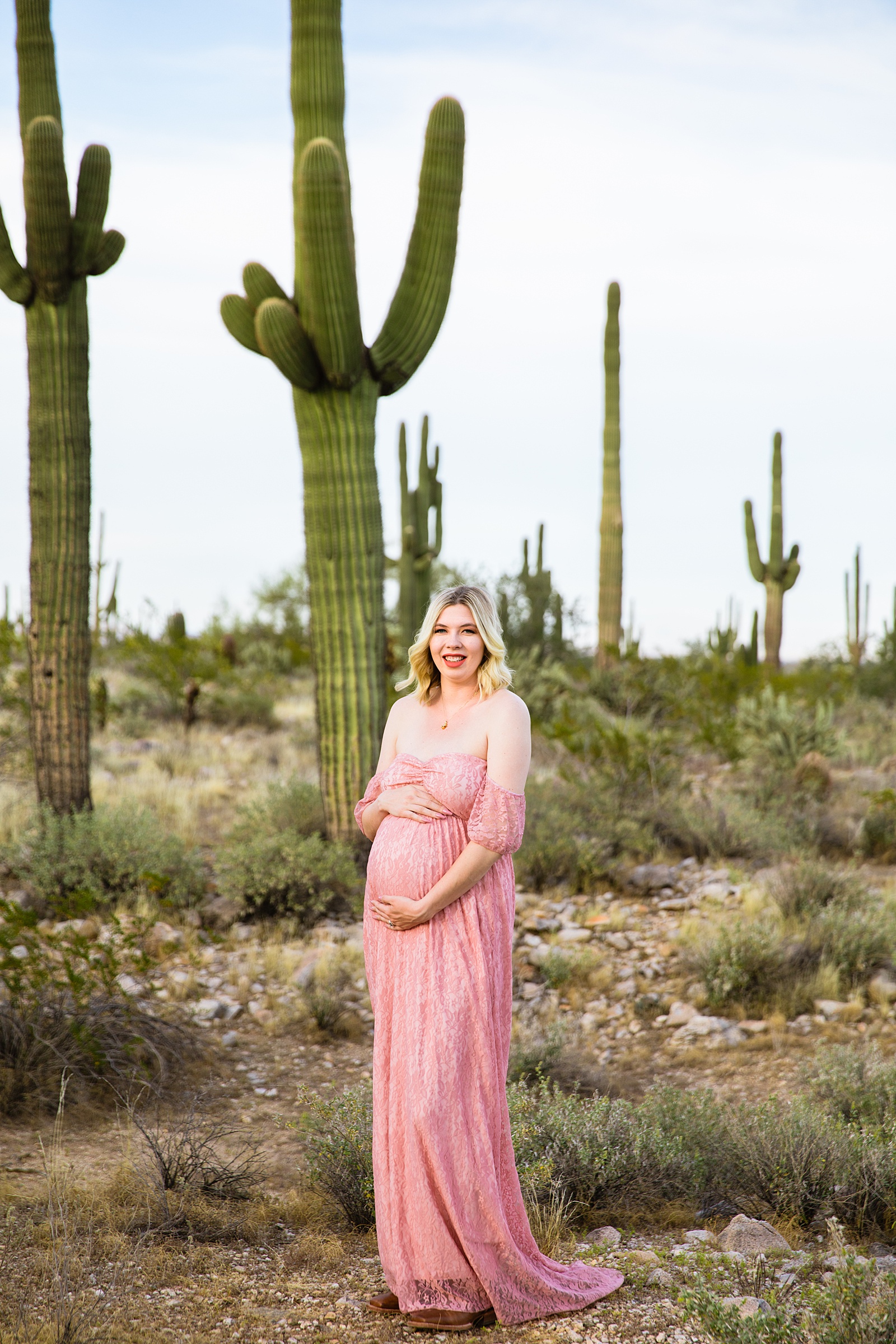 Pregnant mother poses during her Phoenix maternity session by Arizona maternity photographer PMA Photography.