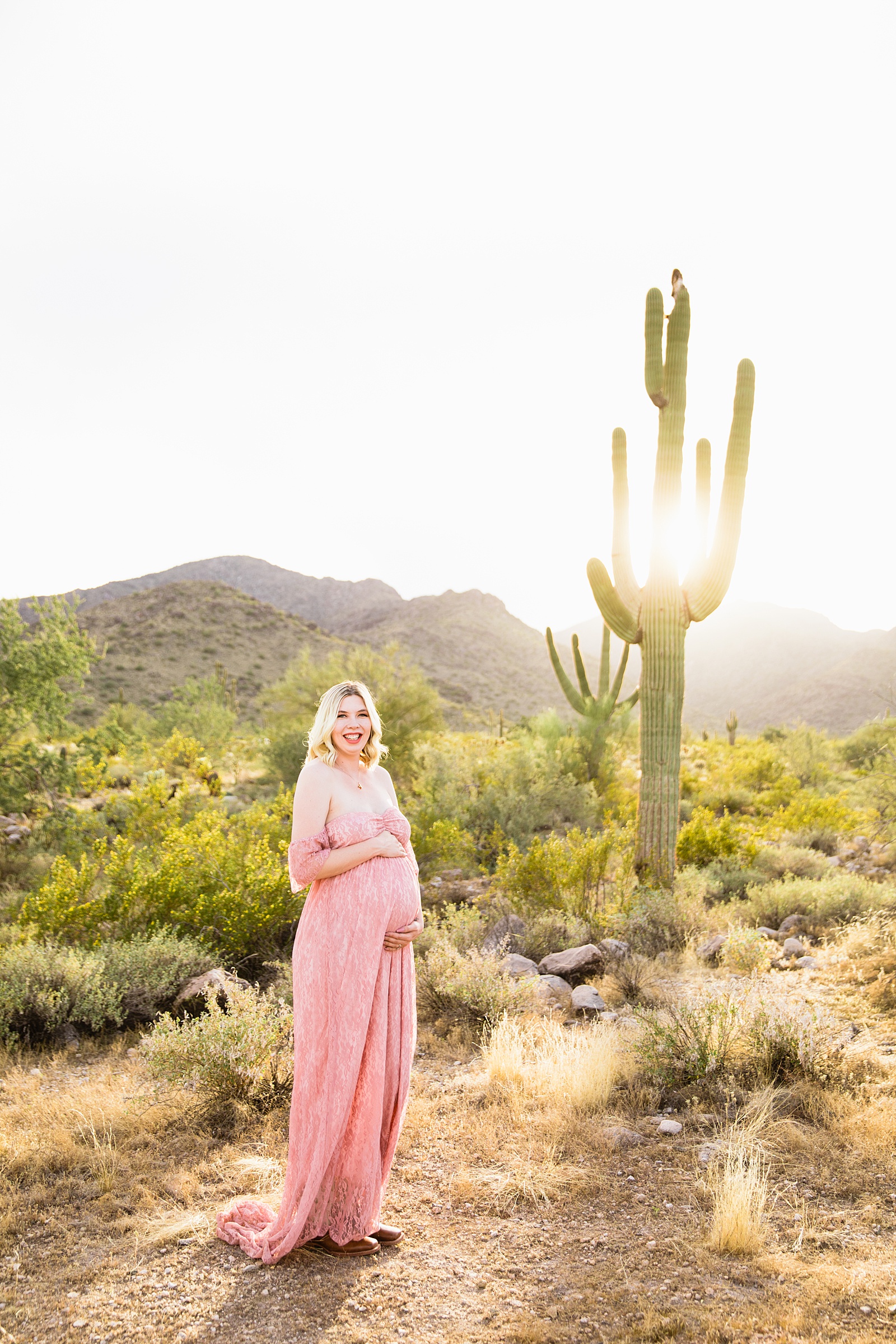 Pregnant mother poses for her White Tanks Desert maternity session by Phoenix maternity photographer PMA Photography.
