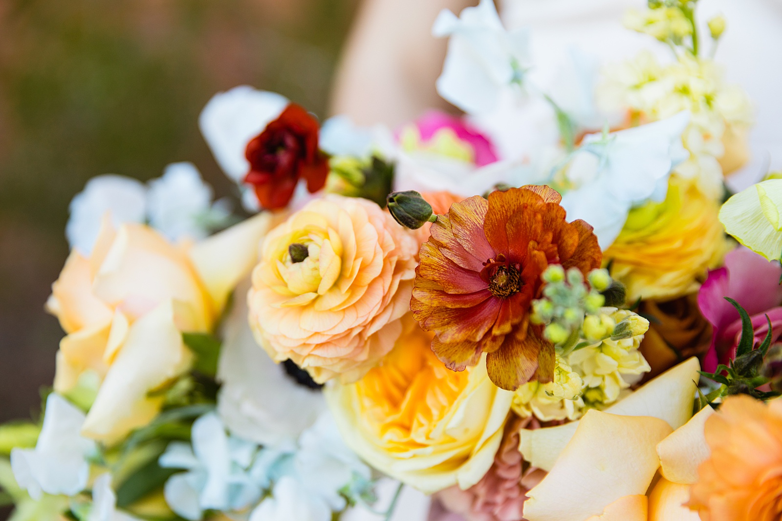 Bride's vibrant bouquet by PMA Photography.
