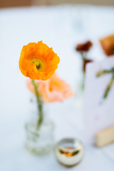 Floral centerpieces at Arizona Historical Society wedding reception by Tempe wedding photographer PMA Photography.