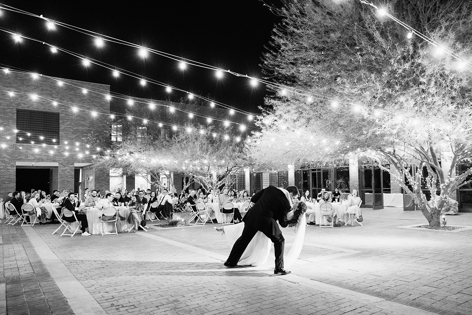 Bride and groom sharing first dance at their Arizona Historical Society wedding reception by Arizona wedding photographer PMA Photography.