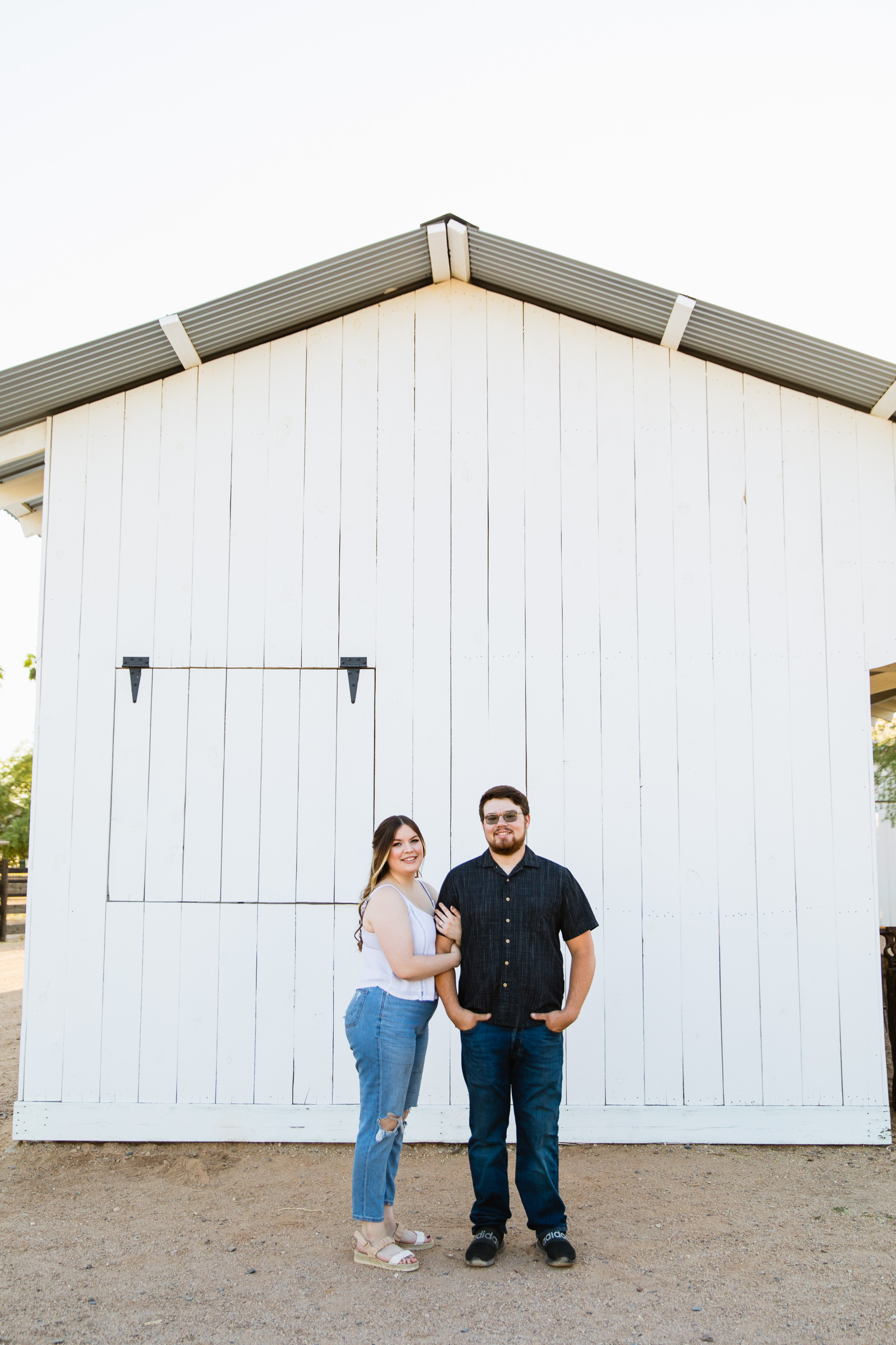 Couple pose for their Sahuaro Ranch engagement session by Glendale wedding photographer PMA Photography.