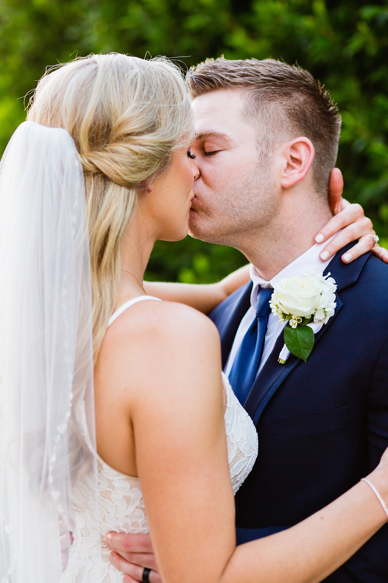 Bride and Groom share a kiss during their Wrigley Mansion wedding by Phoenix wedding photographer PMA Photography.