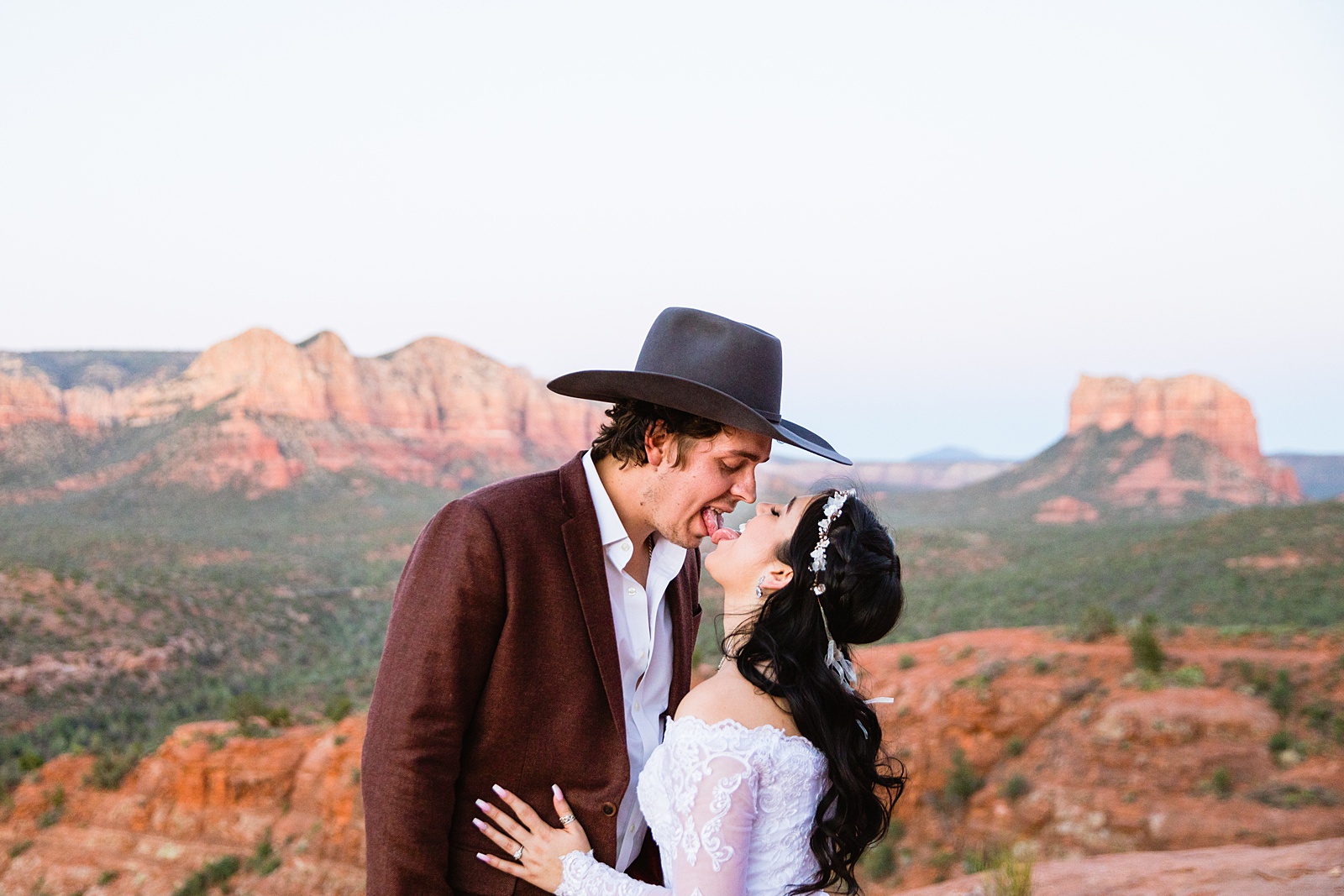 Bride and Groom having fun together during their Cathedral Rock elopement by Sedona elopement photographer PMA Photography.