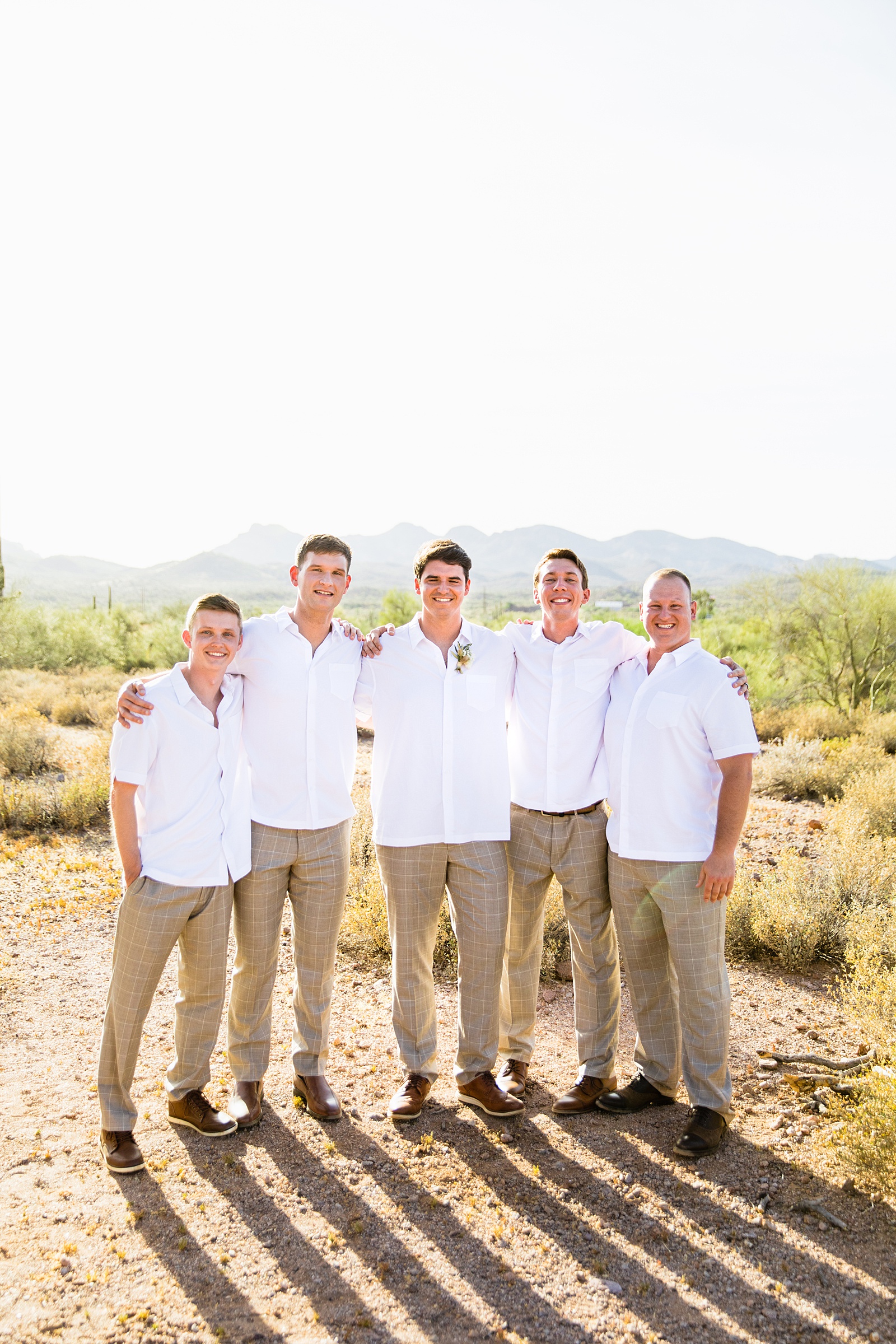 Groom and groomsmen together at a Superstition Mountain Micro wedding by Arizona wedding photographer PMA Photography.
