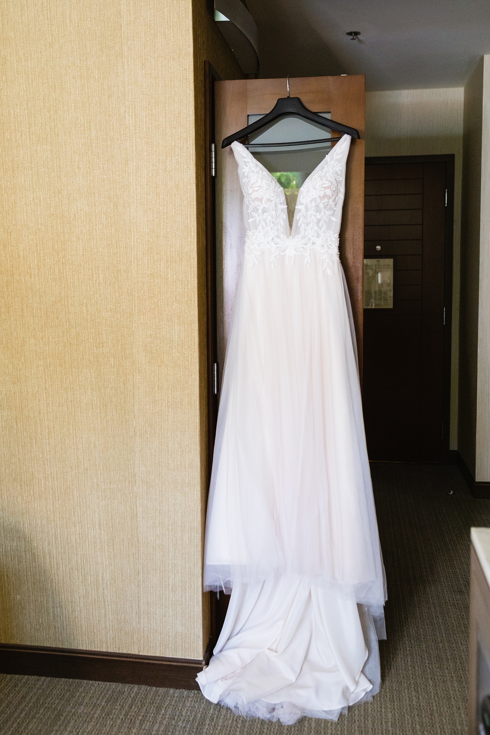 Bride's romantic lace wedding dress for her Hyatt Regency Scottsdale Resort & Spa At Gainey Ranch wedding by PMA Photography.