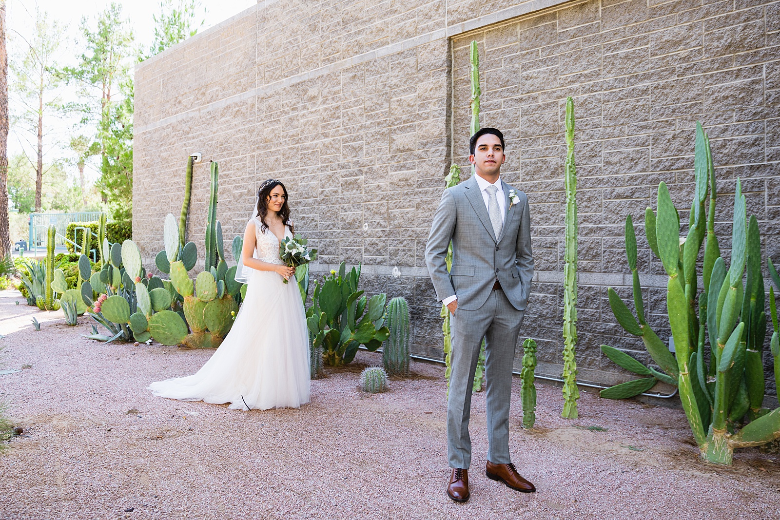 Bride and groom's first look at Hyatt Regency Scottsdale Resort & Spa At Gainey Ranch by Phoenix wedding photographer PMA Photography.