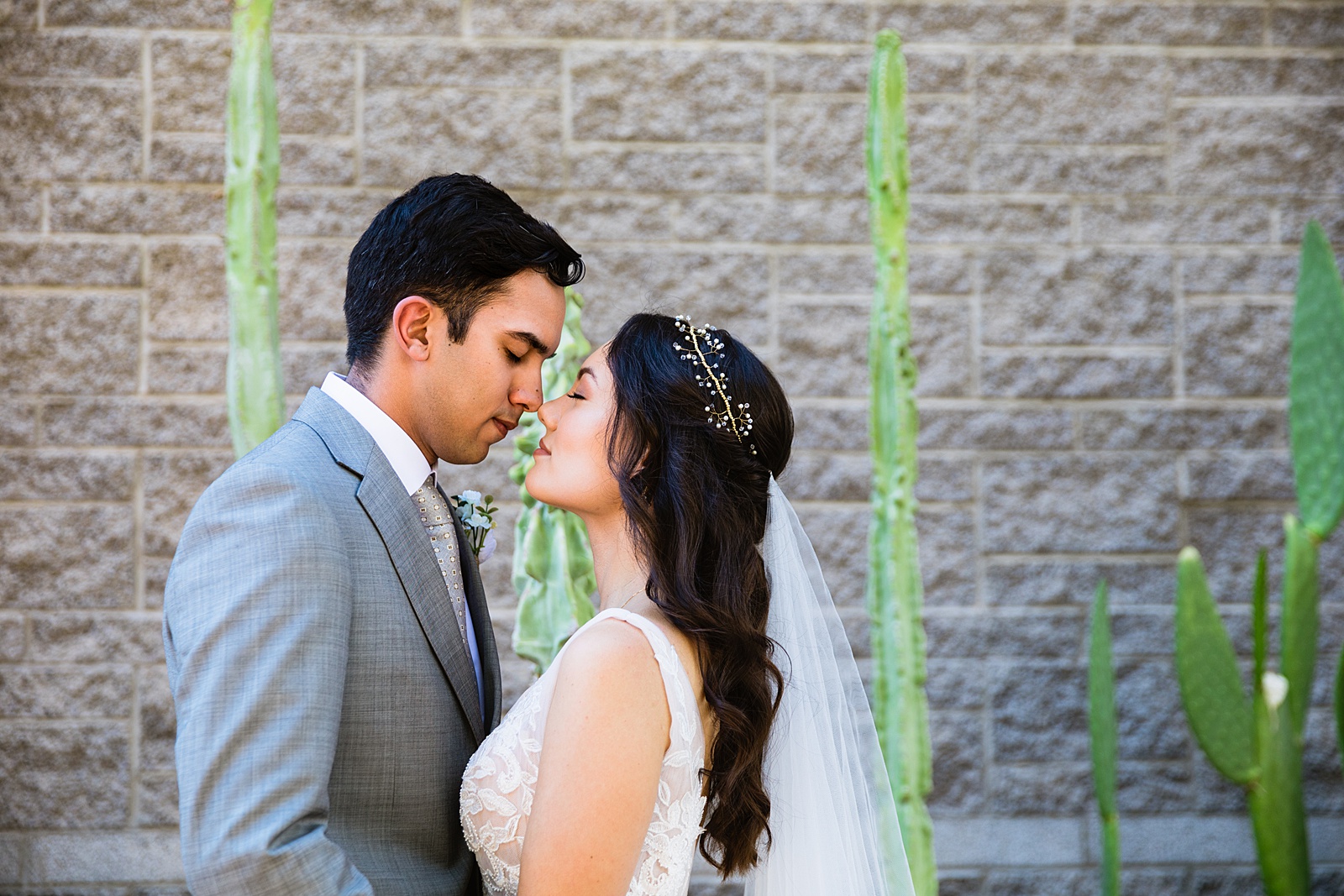 Bride and groom share an intimate moment during their Hyatt Regency Scottsdale Resort & Spa At Gainey Ranch wedding by Scottdsale wedding photographer PMA Photography.