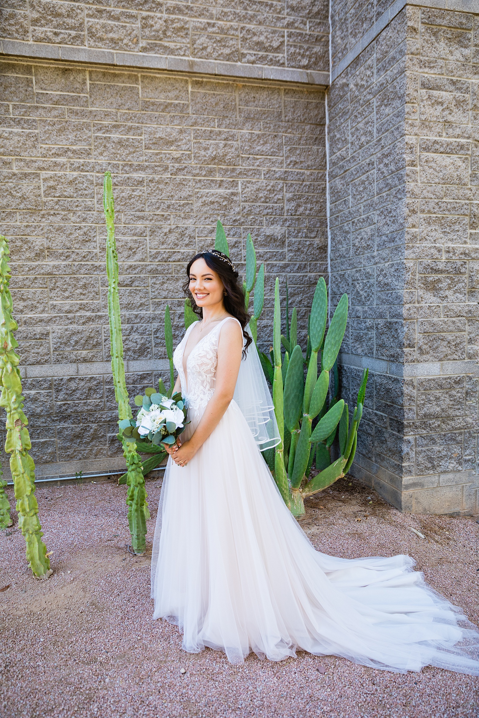 Bride's romantic lace wedding dress for her Hyatt Regency Scottsdale Resort & Spa At Gainey Ranch wedding by PMA Photography.