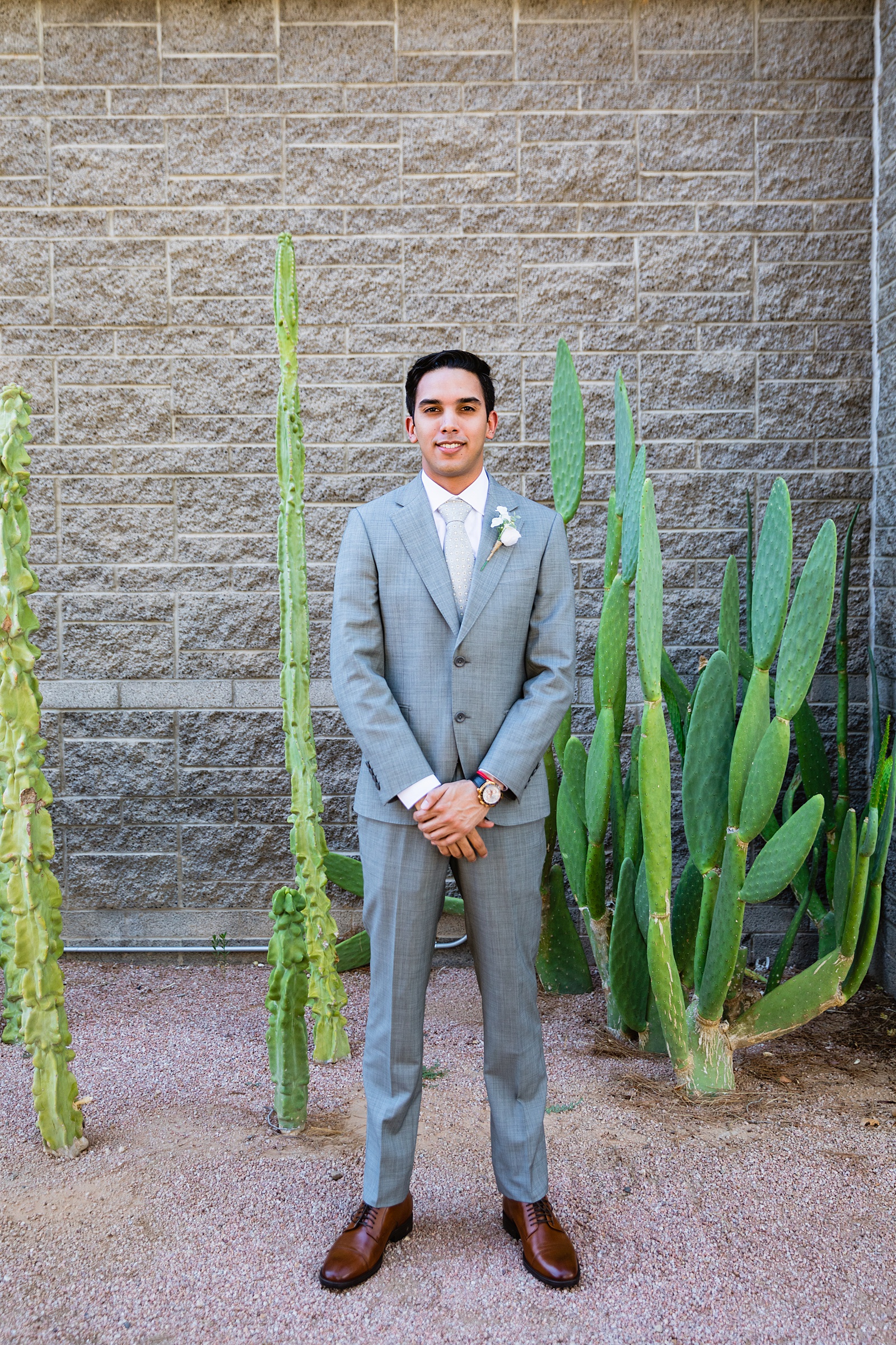 Groom's classic grey suit for his Hyatt Regency Scottsdale Resort & Spa At Gainey Ranch wedding by PMA Photography.