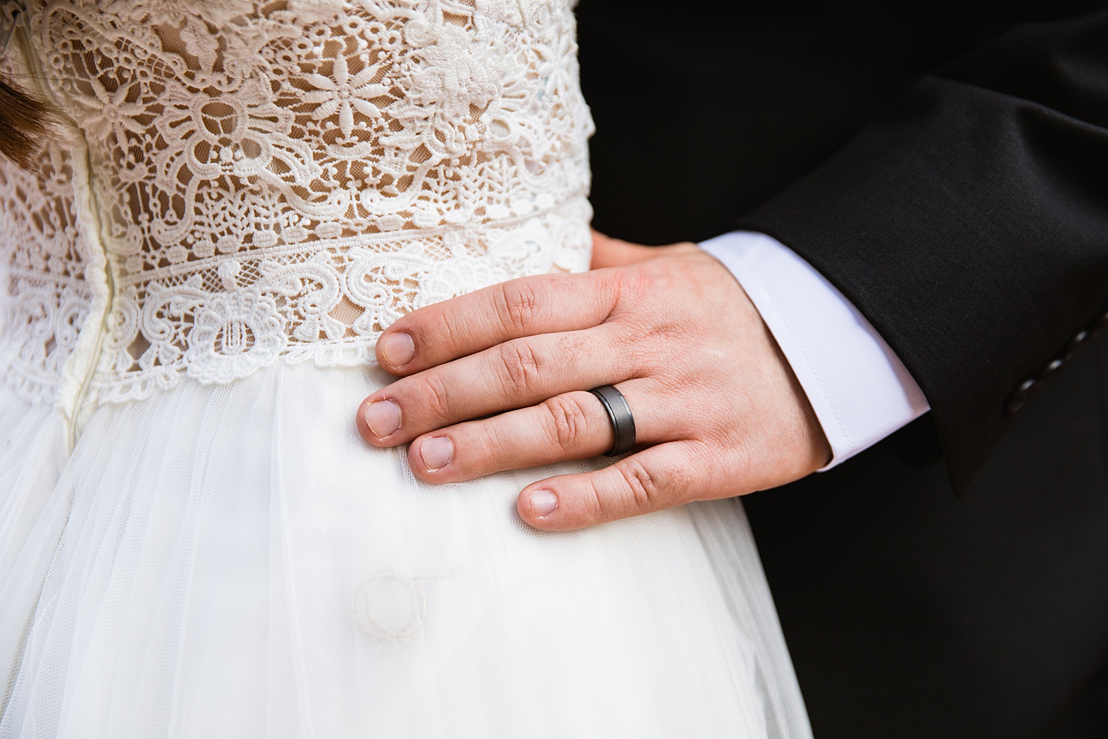 Detail image of wedding rings by PMA Photography.