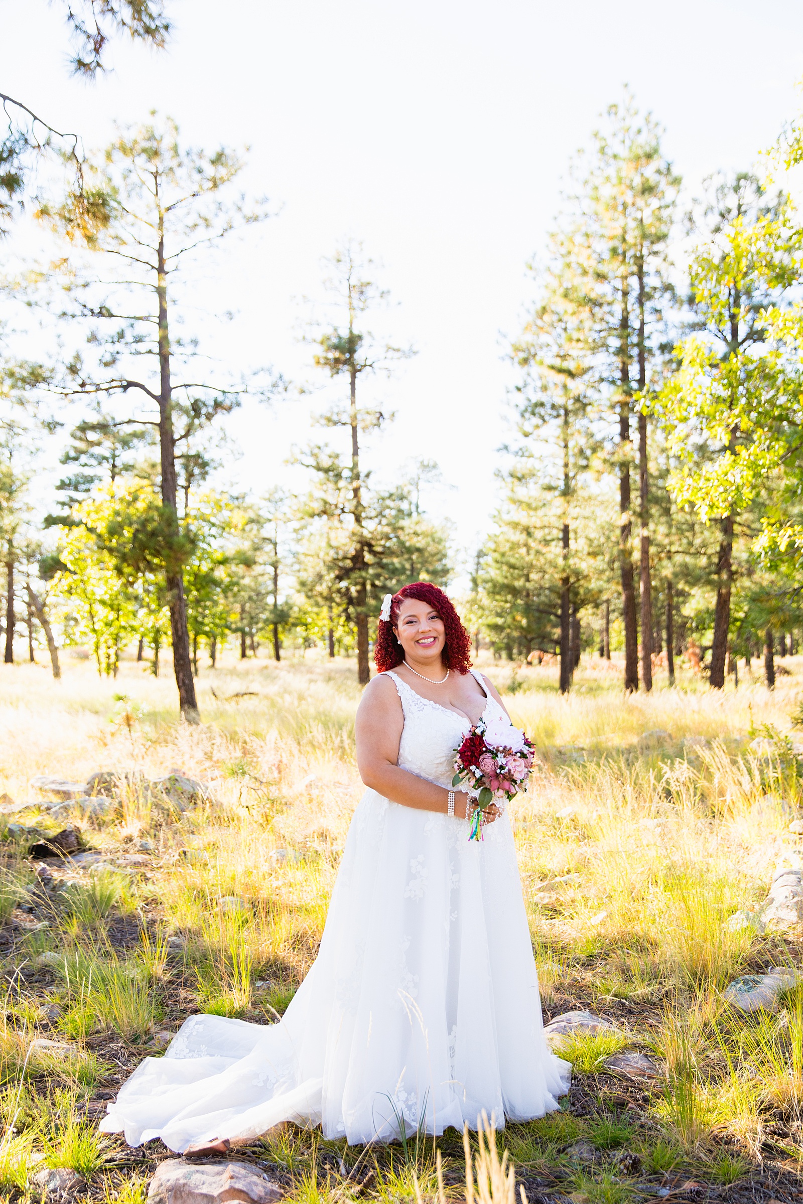 Bride's elegant full traina wedding dress for her Mogollon Rim elopement by PMA Photography.