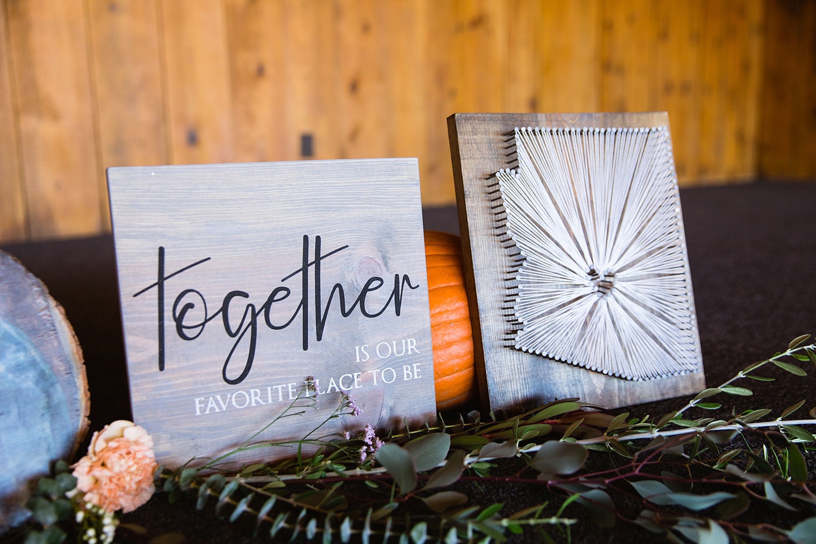 Wedding day details of together is our favorite place to be sign and arizona state sign at welcome table by PMA Photography.