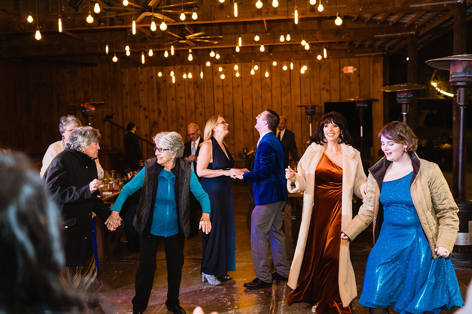 Guests dancing at Mortimer Farms wedding reception by Prescott wedding photographer PMA Photography