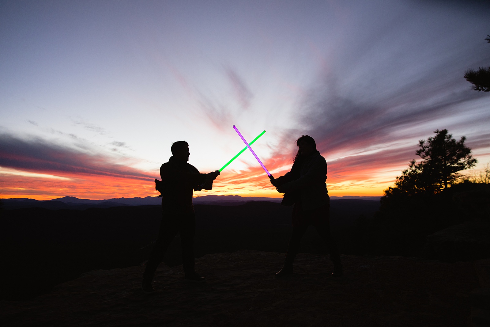 Star Wars Inspired duel with each other during their Payson engagement session by Arizona wedding photographer PMA Photography.