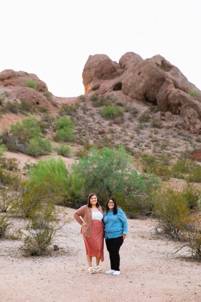 Same sex couple pose for their Papago Park engagement session by Phoenix wedding photographer PMA Photography.