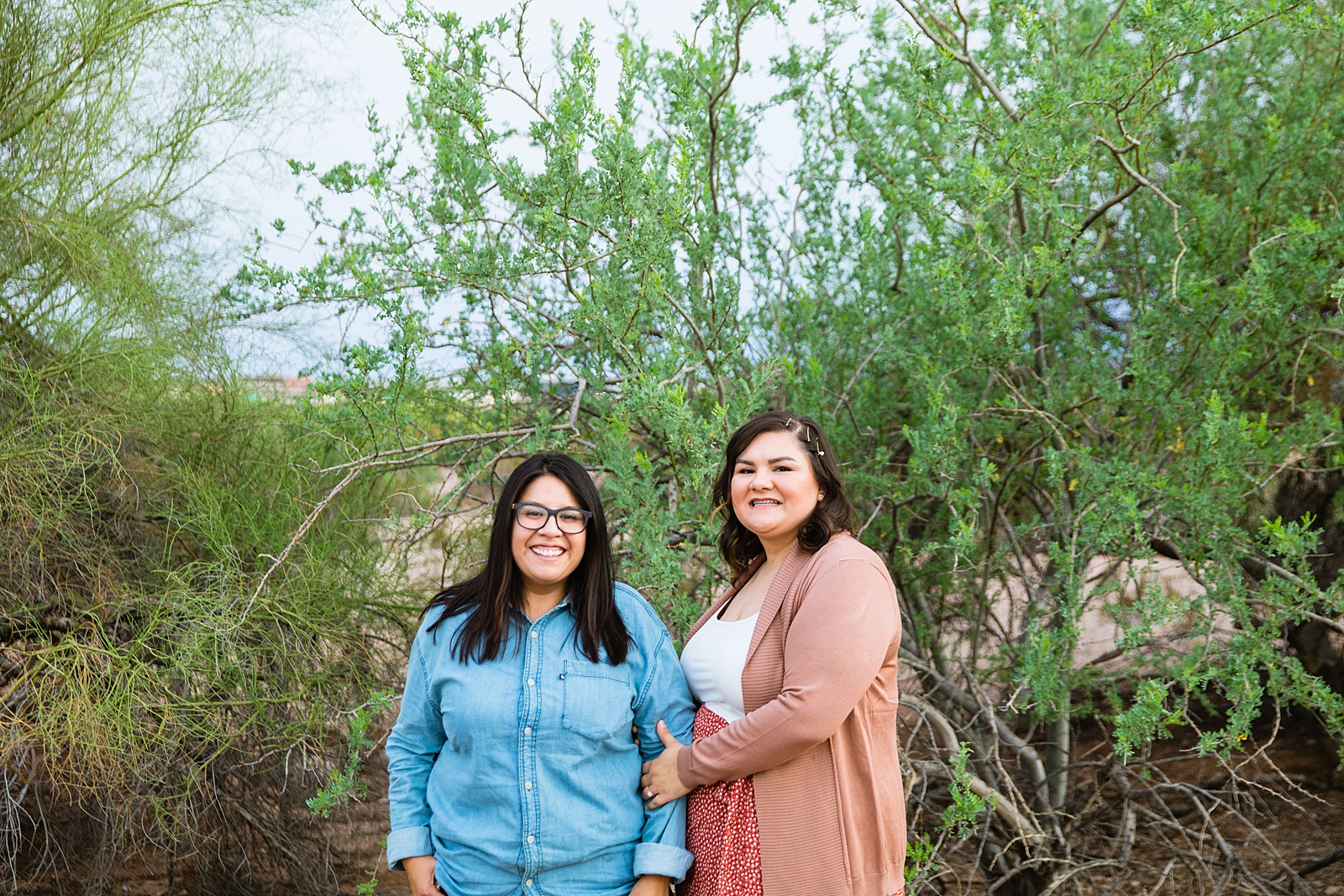 LGBTQ couple pose for their Papago Park engagement session by Phoenix wedding photographer PMA Photography.