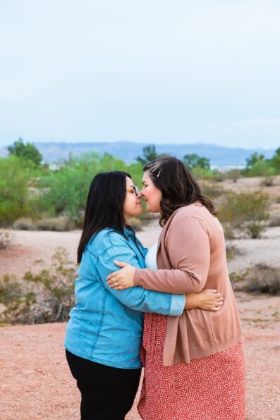 LGBTQ couple share an intimate moment at their Phoenix engagement session by Arizona engagement photographer PMA Photography.