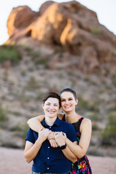 Couple pose for their Papago Park engagement session by Phoenix wedding photographer PMA Photography.